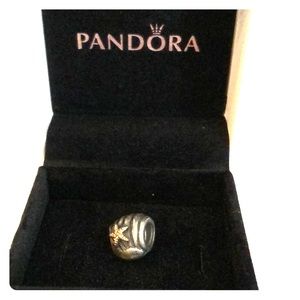 Silver shell charm with gold starfish